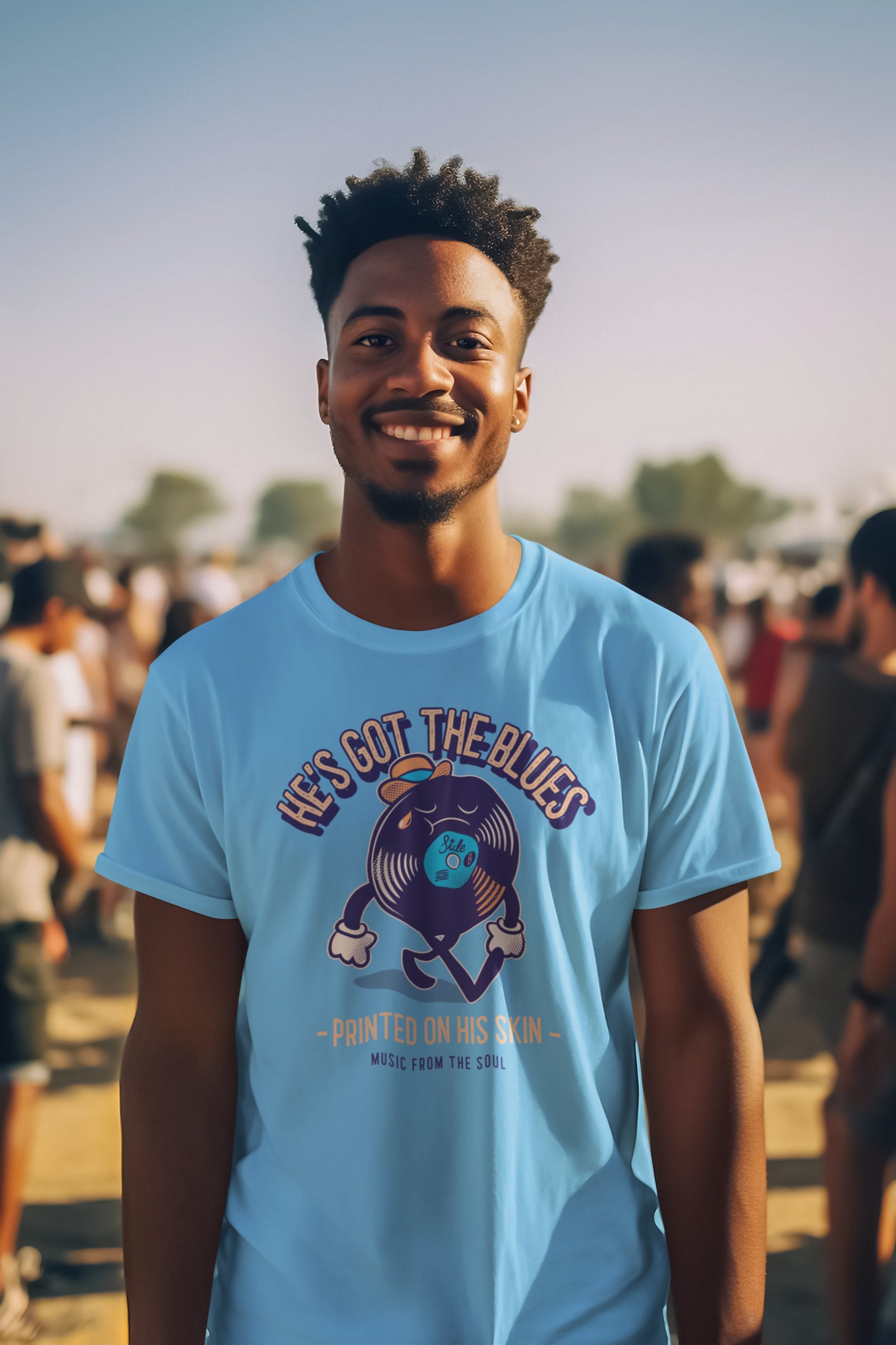 Black man wearing blue retro style "the blues" themed t-shirt.